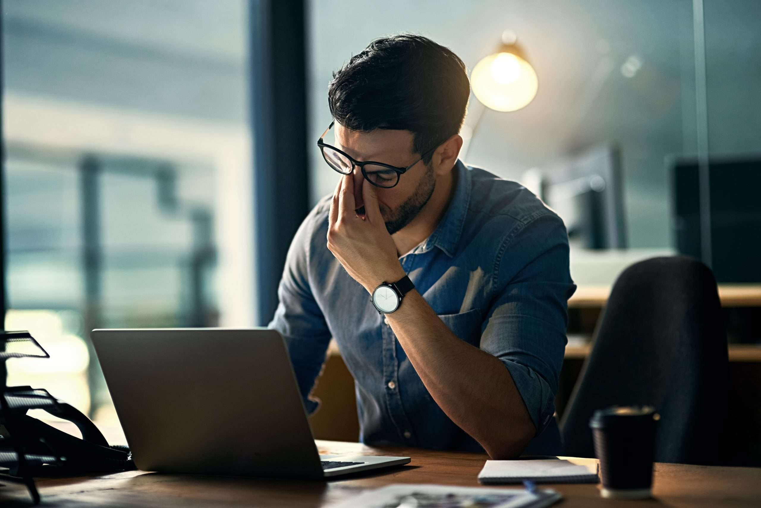 Man looking stressed at work.