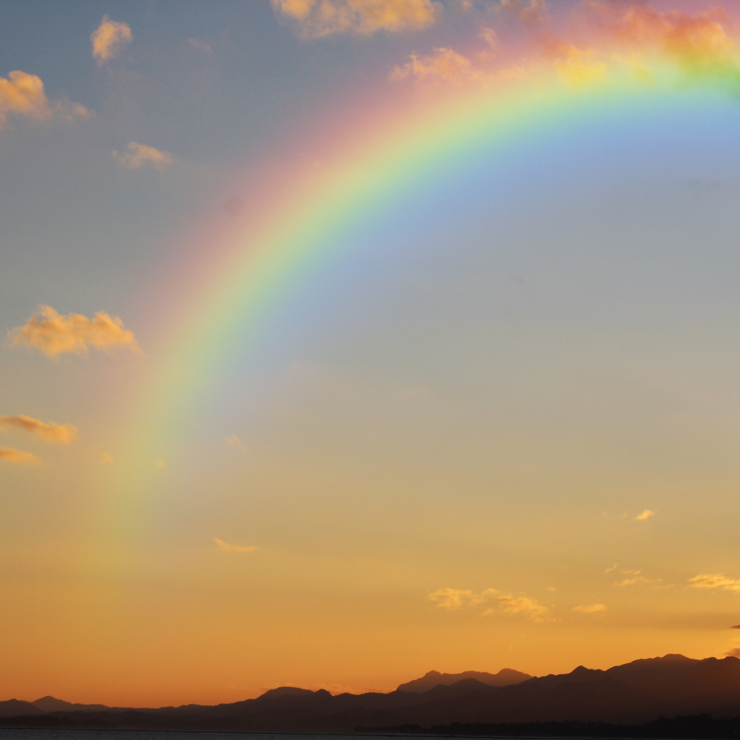 Photo of a rainbow at sunset
